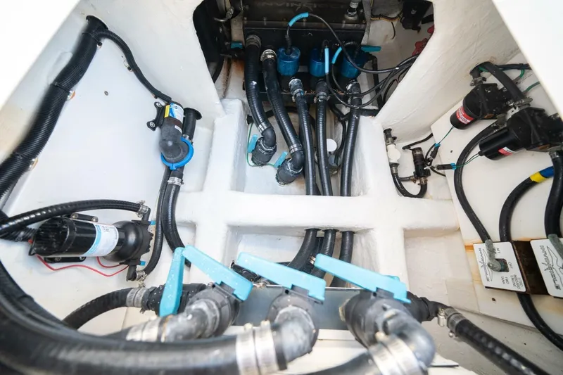 Catallac Yacht Photos Pics Engine room of 2023 Invincible 46 Catamaran with complex piping and wiring system.