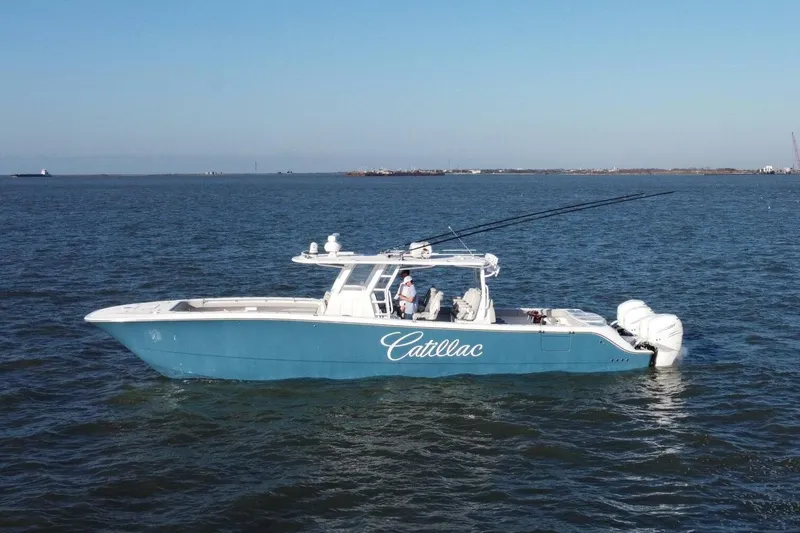 Catallac Yacht Photos Pics 2023 Invincible 46 Catamaran on open water, featuring sleek blue design and powerful engines.