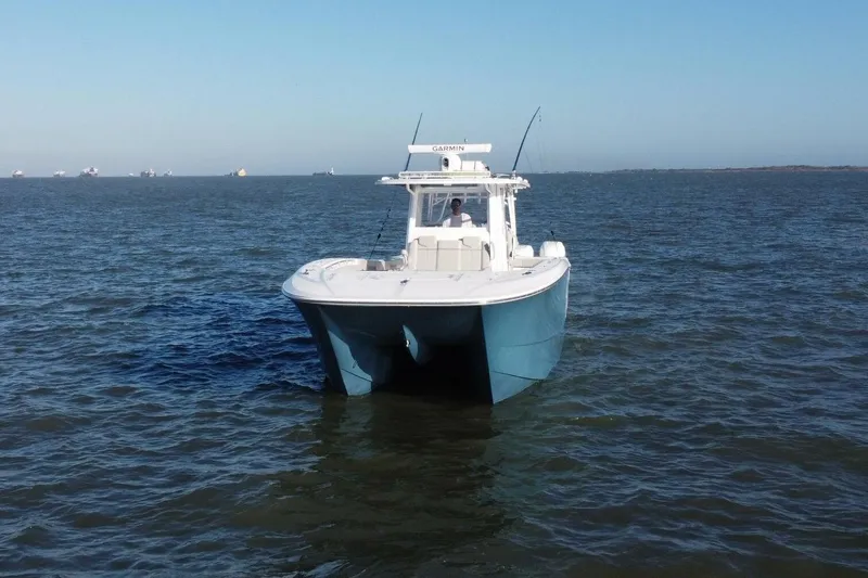 Catallac Yacht Photos Pics 2023 Invincible 46 Catamaran on open water, showcasing sleek design and advanced features.