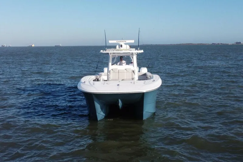 Catallac Yacht Photos Pics 2023 Invincible 46 Catamaran on open water, front view.