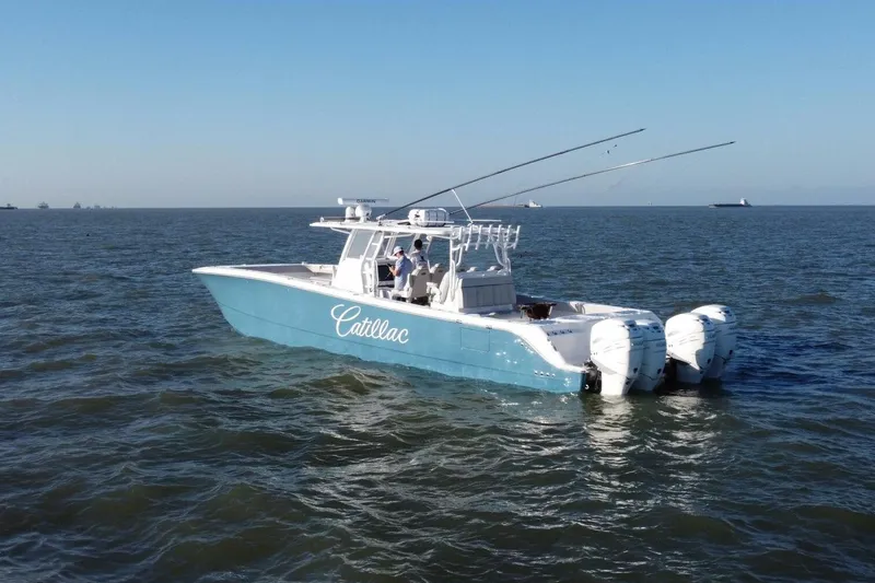 Catallac Yacht Photos Pics 2023 Invincible 46 Catamaran on open water, featuring sleek design and powerful engines.