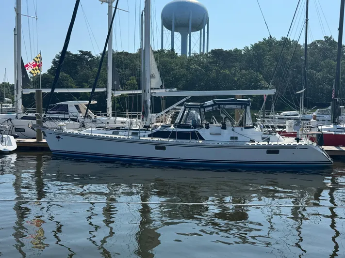 Matilida Yacht Photos Pics Sailboat docked in marina, Hylas 46 model, 2002, with water tower in background.