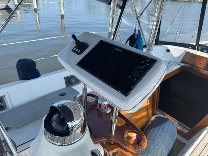 Matilida Yacht Photos Pics Cockpit of 2002 Hylas 46 yacht with navigation equipment and compass.