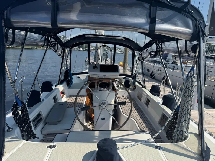 Matilida Yacht Photos Pics Cockpit of a 2002 Hylas 46 sailboat docked at a marina.
