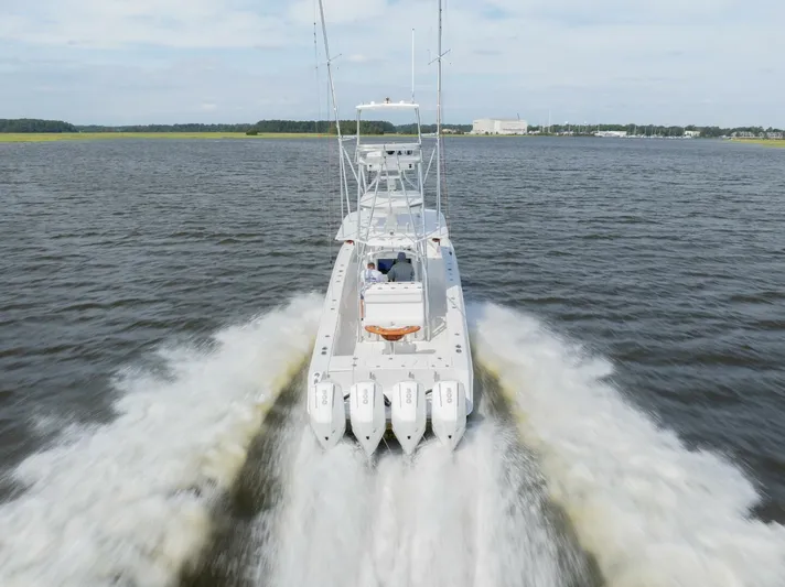 Bill Time Yacht Photos Pics 2016 Bahama 41 boat cruising swiftly on open water.