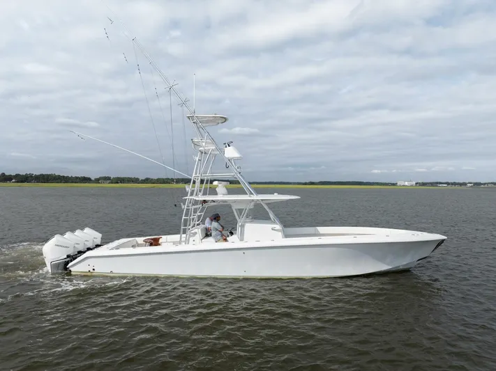 Bill Time Yacht Photos Pics 2016 Bahama 41 boat cruising on open water under cloudy skies.