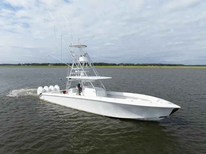 Bill Time Yacht Photos Pics 2016 Bahama 41 boat cruising on open water under cloudy skies.