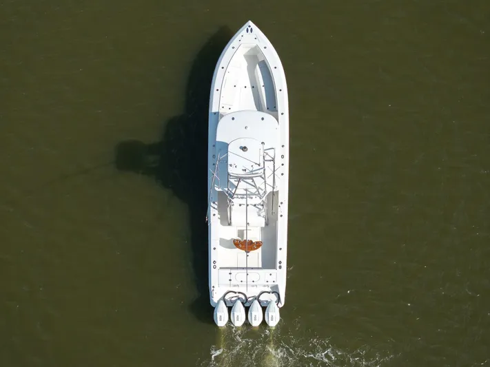 Bill Time Yacht Photos Pics Aerial view of 2016 Bahama 41 boat with four engines on water.