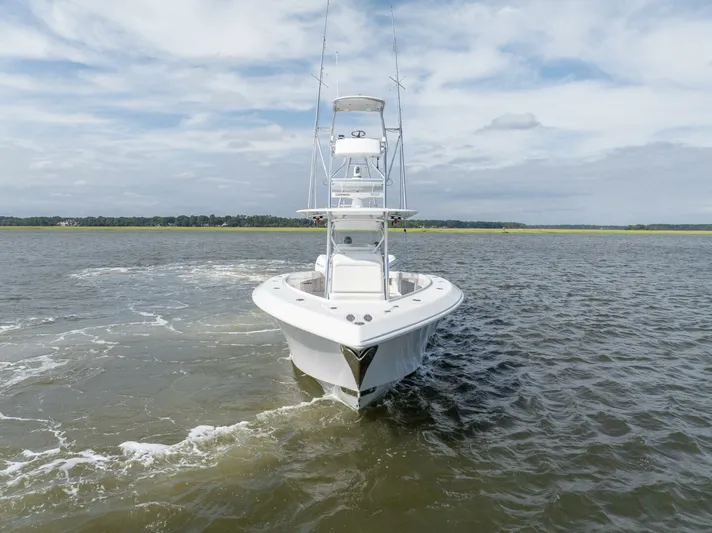 Bill Time Yacht Photos Pics 2016 Bahama 41 boat cruising on open water under a cloudy sky.