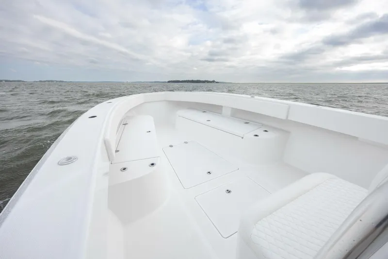 Bill Time Yacht Photos Pics 2016 Bahama 41 boat deck with ocean view under cloudy sky.