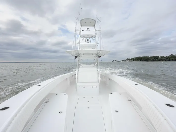 Bill Time Yacht Photos Pics 2016 Bahama 41 boat cruising on open water under cloudy skies.