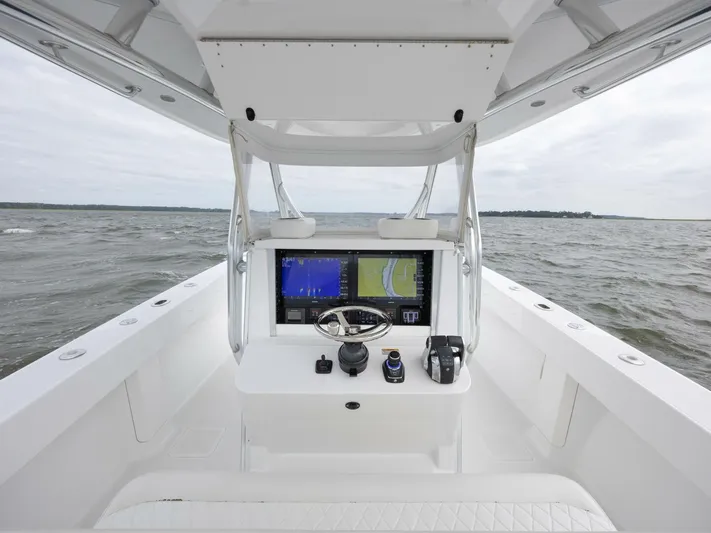 Bill Time Yacht Photos Pics 2016 Bahama 41 boat helm with dual navigation screens on open water.