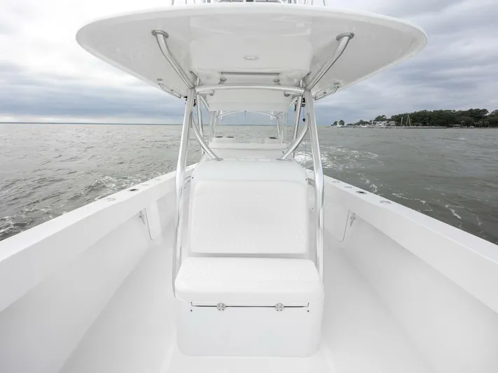 Bill Time Yacht Photos Pics 2016 Bahama 41 boat on open water, featuring sleek white design and spacious deck.