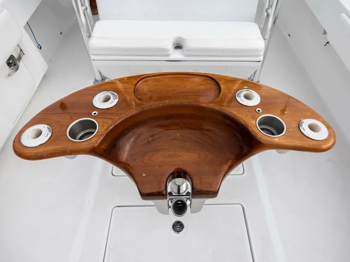 Bill Time Yacht Photos Pics Wooden helm station on 2016 Bahama 41 boat with cup holders.