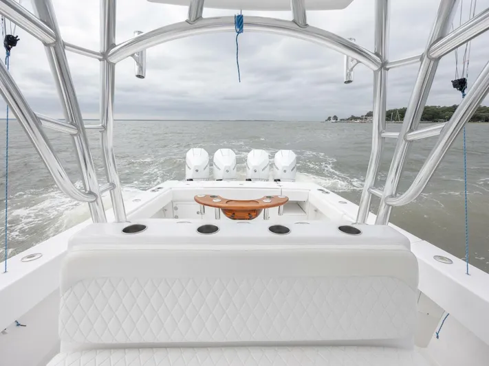 Bill Time Yacht Photos Pics 2016 Bahama 41 boat with four engines, spacious deck, and ocean view.