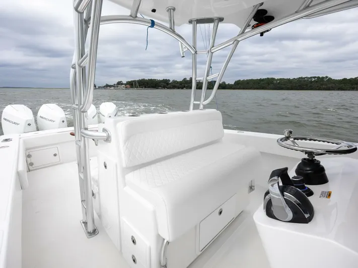 Bill Time Yacht Photos Pics 2016 Bahama 41 boat interior with white seating and ocean view.