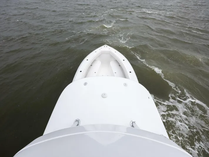 Bill Time Yacht Photos Pics 2016 Bahama 41 boat cruising on open water, aerial view.