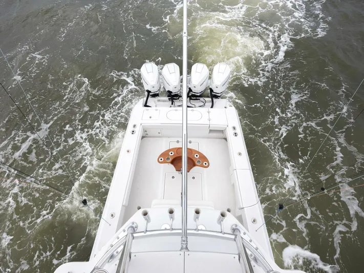Bill Time Yacht Photos Pics Aerial view of 2016 Bahama 41 boat with triple engines on choppy water.