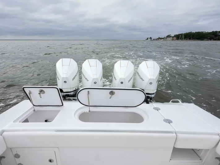 Bill Time Yacht Photos Pics 2016 Bahama 41 boat with four powerful outboard engines on open water.