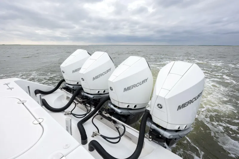 Bill Time Yacht Photos Pics 2016 Bahama 41 boat with triple Mercury outboard engines on open water.