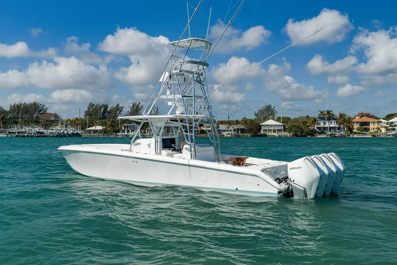 Bill Time Yacht Photos Pics 2016 Bahama 41 boat on turquoise water, clear sky, coastal background.