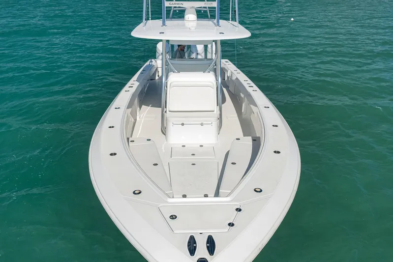 Bill Time Yacht Photos Pics 2016 Bahama 41 boat on clear blue water, showcasing sleek design and spacious deck.