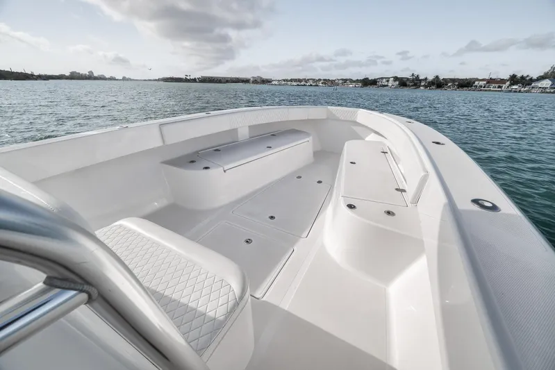 Bill Time Yacht Photos Pics 2016 Bahama 41 boat interior with seating, on calm water, under cloudy sky.