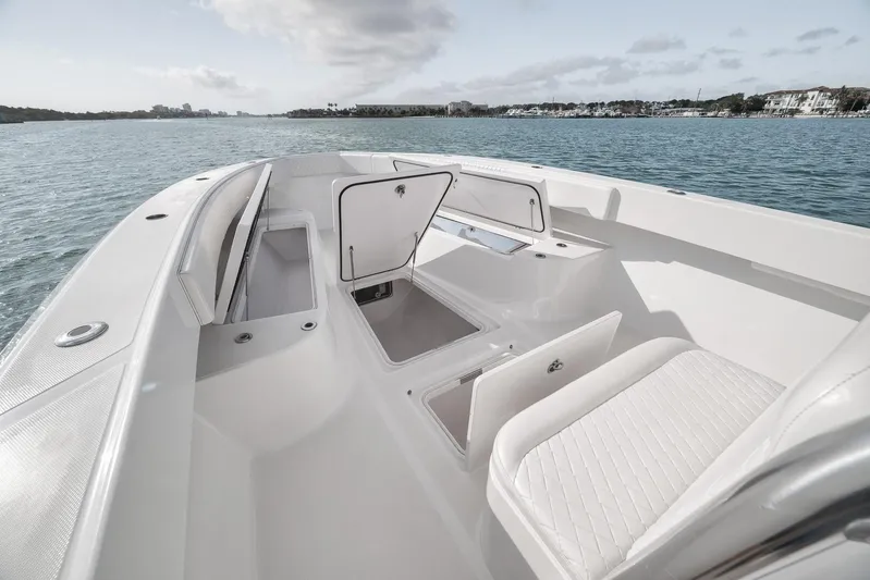 Bill Time Yacht Photos Pics 2016 Bahama 41 boat interior with open storage compartments on calm water.
