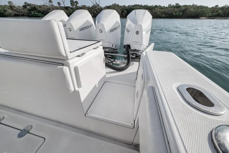 Bill Time Yacht Photos Pics 2016 Bahama 41 boat with Mercury engines, sleek design, and spacious deck by the water.