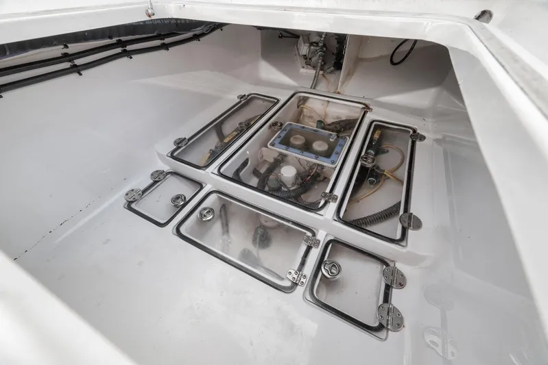 Bill Time Yacht Photos Pics 2016 Bahama 41 boat storage compartment with visible wiring and equipment.