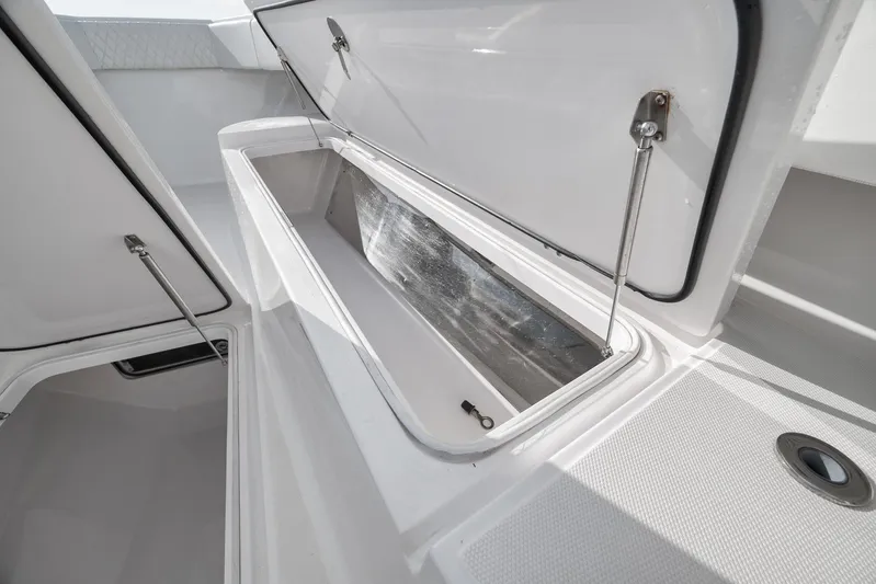 Bill Time Yacht Photos Pics Open storage compartment on a 2016 Bahama 41 boat, showcasing spacious interior.