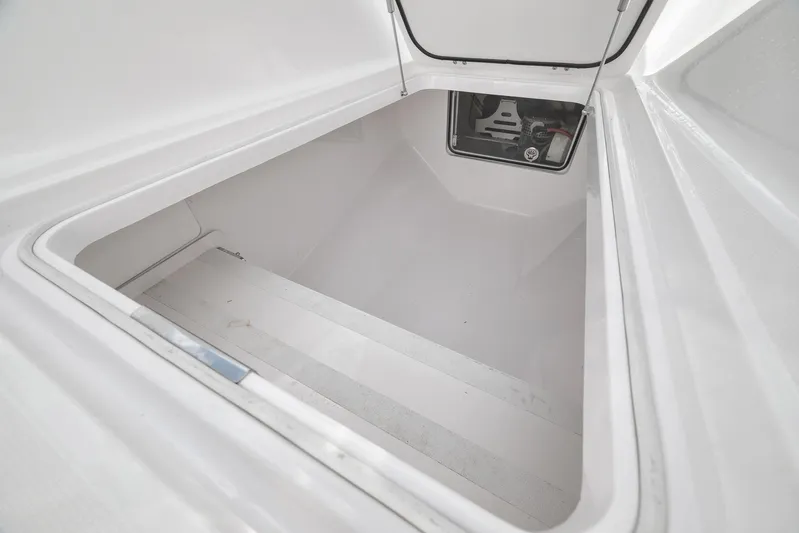 Bill Time Yacht Photos Pics 2016 Bahama 41 boat storage compartment with open hatch, showcasing interior space.