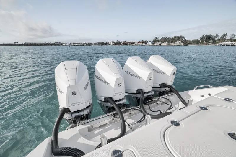 Bill Time Yacht Photos Pics 2016 Bahama 41 boat with four Mercury Verado engines on calm water.