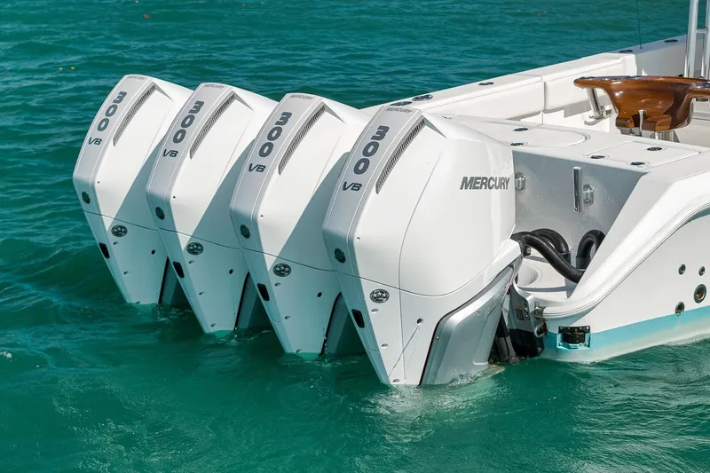 Bill Time Yacht Photos Pics 2016 Bahama 41 boat with four Mercury 300 V8 engines on turquoise water.