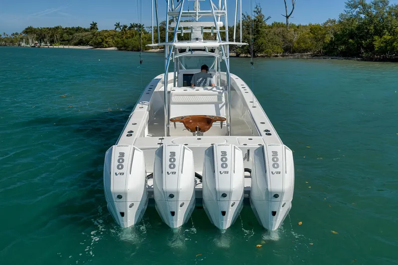 Bill Time Yacht Photos Pics 2016 Bahama 41 boat with four Mercury 300 V8 engines on turquoise water.