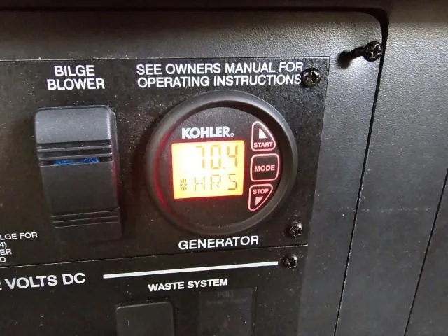  Yacht Photos Pics Kohler generator control panel on 2017 Sea Ray Sundancer 350 Coupe, showing 704 hours.