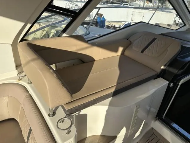  Yacht Photos Pics 2017 Sea Ray Sundancer 350 Coupe interior with beige seating and modern design.