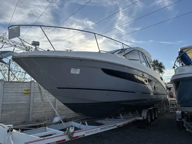  Yacht Photos Pics 2017 Sea Ray Sundancer 350 Coupe on trailer, parked outdoors.