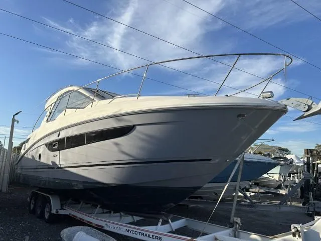  Yacht Photos Pics 2017 Sea Ray Sundancer 350 Coupe on trailer, docked under clear sky.