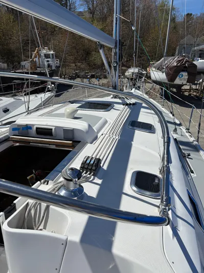 Lucky Dog Too Yacht Photos Pics 2008 Hunter 41 DS sailboat deck with rigging and winch, docked in a marina.