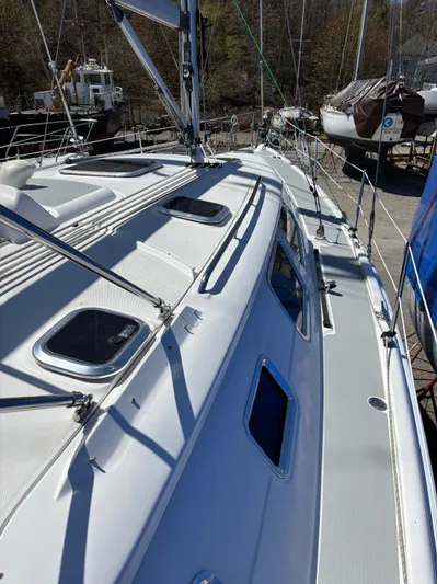 Lucky Dog Too Yacht Photos Pics 2008 Hunter 41 DS sailboat deck view, showcasing sleek design and hatches.