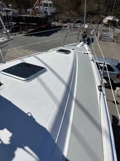 Lucky Dog Too Yacht Photos Pics 2008 Hunter 41 DS sailboat deck view in a boatyard setting.