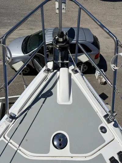 Lucky Dog Too Yacht Photos Pics Bow of 2008 Hunter 41 DS sailboat with car in background.