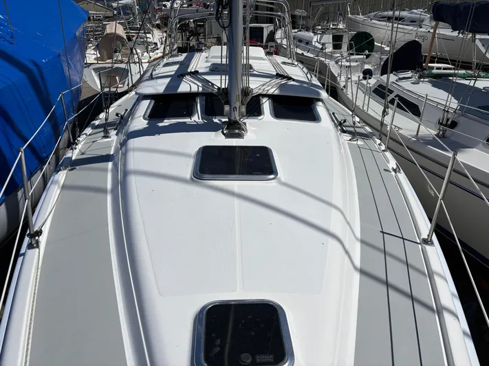 Lucky Dog Too Yacht Photos Pics 2008 Hunter 41 DS sailboat deck view in marina, surrounded by other boats.