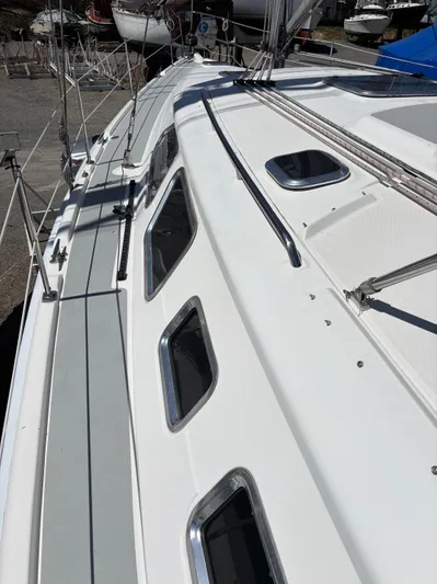 Lucky Dog Too Yacht Photos Pics 2008 Hunter 41 DS sailboat deck with sleek design and multiple windows.