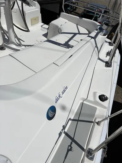 Lucky Dog Too Yacht Photos Pics Hunter 41 DS 2008 deck salon, white seating area, stainless steel railings, sunny day.