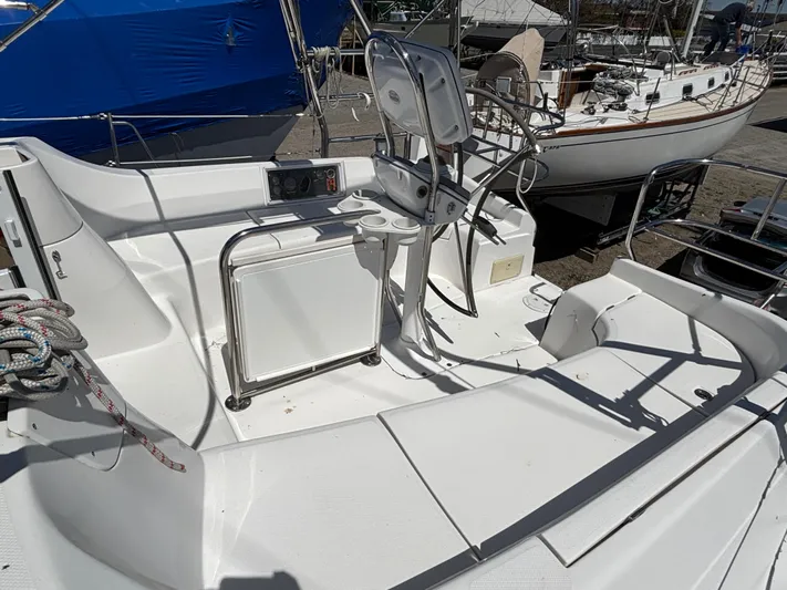 Lucky Dog Too Yacht Photos Pics 2008 Hunter 41 DS sailboat cockpit with steering wheel and seating area.
