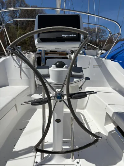 Lucky Dog Too Yacht Photos Pics Steering wheel and navigation system on a 2008 Hunter 41 DS sailboat.