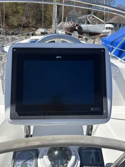 Lucky Dog Too Yacht Photos Pics Control panel of a 2008 Hunter 41 DS sailboat with navigation instruments.