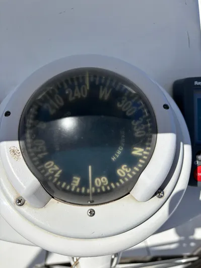 Lucky Dog Too Yacht Photos Pics Close-up of a compass on a 2008 Hunter 41 DS sailboat.